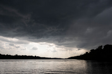 Beautiful view to heavy rain clouds over amazon rainforest island