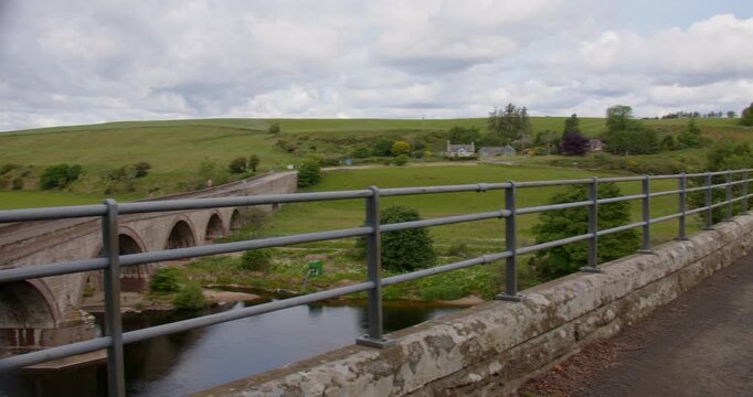 Panning Wide shot looking north of the cycle path on top of the North water viaduct over the river north ESK