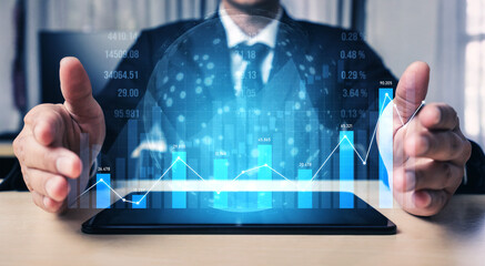 A businessman presents a tablet displaying a dynamic digital data visualization. The hands emphasize growth, analytics, and financial statistics in a modern office. Scalp