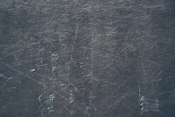 Skate marks reveal dynamic history on ice, perfect for sports backgrounds, winter themes, and athletic lifestyle concepts with a textured, cool surface