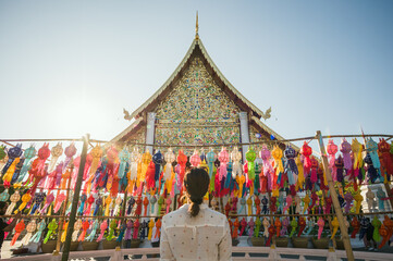 Woman at the temple with paper lanterns, Wat Chedi Luang, Chiang Mai, Thailand