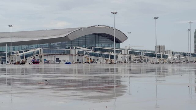 Wuchuan Airport Terminal Construction Site in Zhanjiang with Wet Runway Reflections