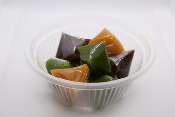 dodol, a traditional sweet confectionery popular in Southeast Asia, particularly Indonesia and Malaysia. It has a chewy, sticky, and caramel-like texture. 