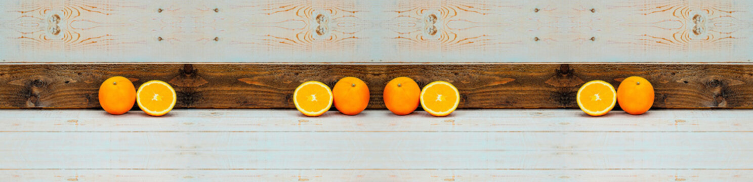  Arancia intera e arancia a meta in composizione speculare