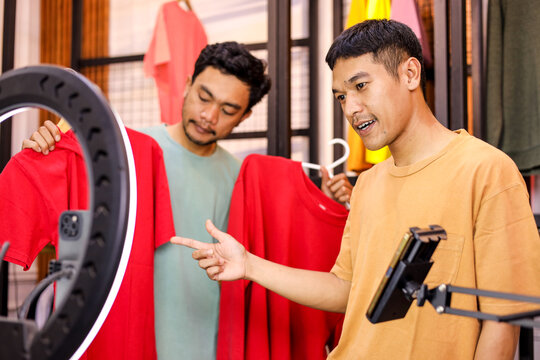 Dynamic Duo Streams Live Fashion Review, Shows Off Bright Red Outfits for Online Audience