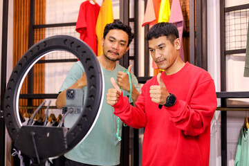 Tailor Meticulously Measures Back Length on Person Wearing Red Sweatshirt