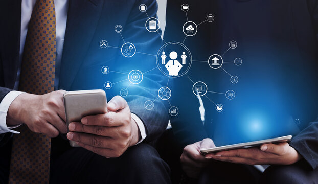 A concept of centralized business management and corporate strategy. A leadership team connecting to all functions like finance, operations, and planning. Motif