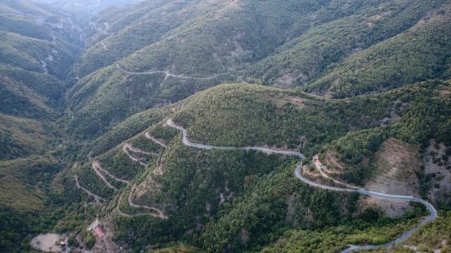Impressive canyon with cliffs, sharp turns and dense vegetation in Greece