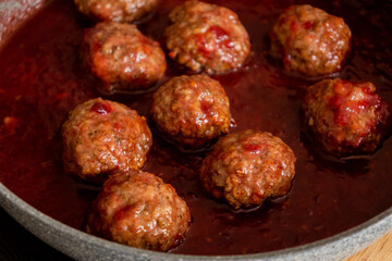 turkey meatballs with cranberry sauce in pan