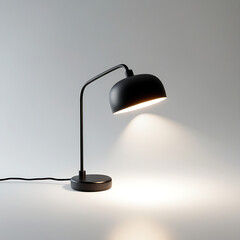 Black table desk lamp lighting design object with electric bulb illuminated on dark room furniture interior