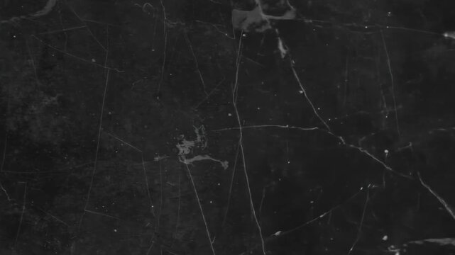 A dark, textured background showcasing a surface with subtle variations and linear patterns, evoking a sense of depth