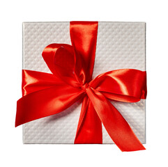 White gift box wrapped in red ribbon with big bow.