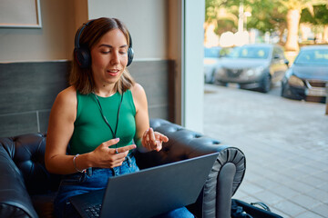 Woman talking during video call in cafe