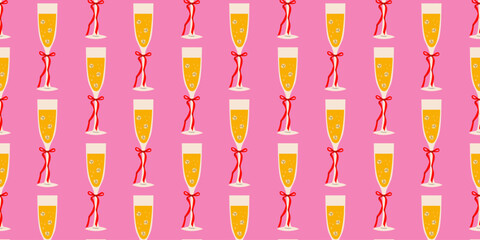 Festive champagne flutes with red ribbons on a pink background for celebrations or parties