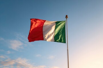 Italian flag waving against a blue sky