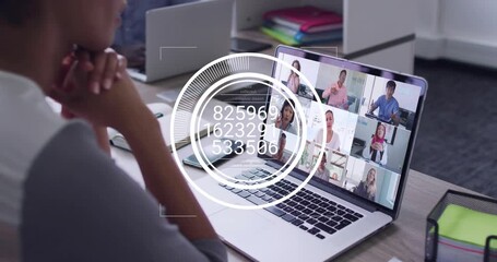 Seated woman watching laptop grid as speakers initiating HUD cycling numbers for business analytics - Powered by Adobe