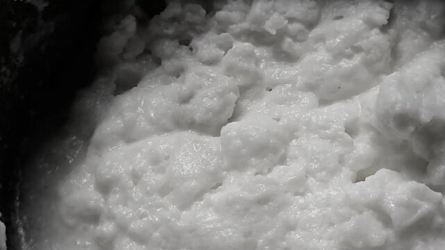 Homemade butter cream is churned malai (milk fat) with water, separating the white butter lumps from residual buttermilk or whey (taak). The washed butter is used fresh or for ghee,  taak is for dahi.