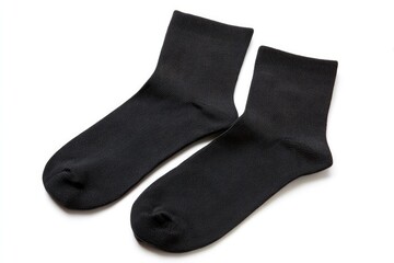 Two black socks lay sidebyside on a white surface casting shadows