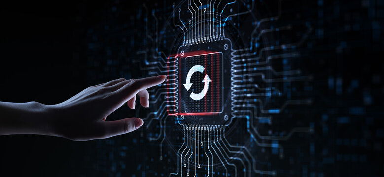 Software Update Ensuring System Efficiency Illustrated on a Processor Touched by a Human Hand.