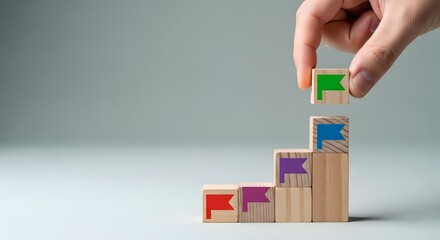 Building a staircase to success with wooden blocks and hand placement