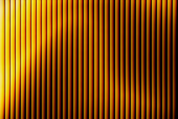 Abstract background featuring a pattern of vertical golden lines with a radiant gradient, creating a modern and elegant texture