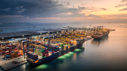 Aerial view of container terminal and cargo ship with crane bridge for logistics import and export cargo background.