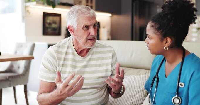 Senior man, nurse and discussion on couch, questions and assessment for chest pain in retirement home. People, caregiver and sore throat with writing symptoms, talk or consultation on sofa at house