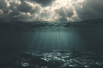Dramatic Sunlight Piercing Through Storm Clouds Over Dark Ocean Surface Abstract Underwater View