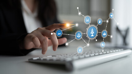 A close-up of a professional woman hand interacting with technology, symbolizing digital...