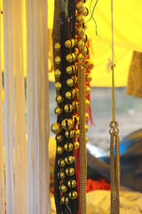 Metal ghungroos for animals are for sale in a traditional street market