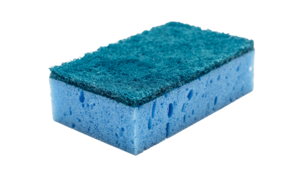A blue rectangular sponge with a green abrasive pad on top, oriented diagonally, casting a shadow to the right on white
