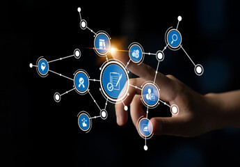 A hand reaches out to interact with a digital interface, showcasing various data points and symbols...