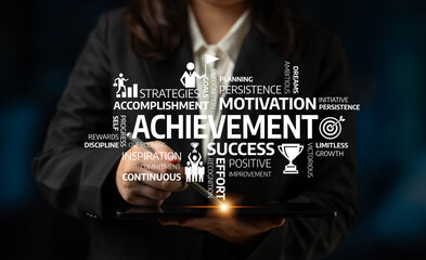 A business professional interacts with a digital tablet displaying powerful words related to achievement and motivation, symbolizing growth and success in professional life. Tessel