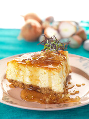 piece of cheese cake with on onion chutney topping