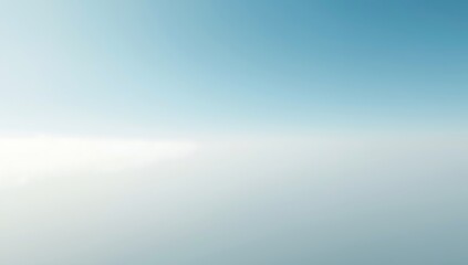 Soft blue sky with subtle white clouds and bright sunlight