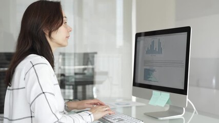 Business colleagues analyzing financial data on computer, discussing project statistics and market trends in office meeting. Businesspeople concept - Powered by Adobe