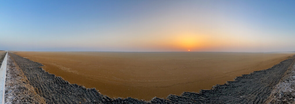 Endless stretches of the Rann fade into soft sunset hues, capturing the surreal stillness and vast beauty of Dholavira&rsquo;s salt desert.