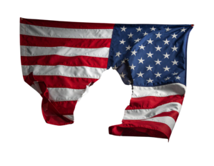 Torn American flag on the grey dusty ground