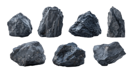 Dark, rough, textured, angular stones isolated on a black background, a collection of geological specimens