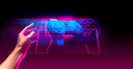 gamer hand touching and interactive to holographic of gaming joystick controller, game and esports technology