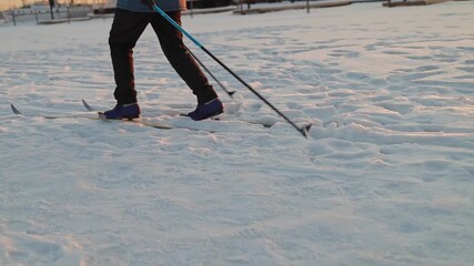 A close-up of a woman skier s legs, emphasizing the importance of physical activity. Concept: Wellness programs, winter sports events, active recreation clubs.