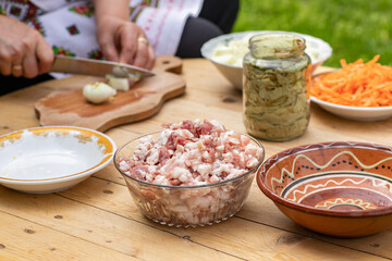Grandma prepares traditional dolma in the country, abroad, in the Republic of Moldova or Romania. Dolma is a family of stuffed dishes associated with Ottoman cuisine.