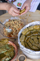 Grandma prepares traditional dolma in the country, abroad, in the Republic of Moldova or Romania. Dolma is a family of stuffed dishes associated with Ottoman cuisine.