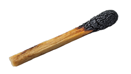 Close-up of a single wooden matchstick with a completely burnt, charred head