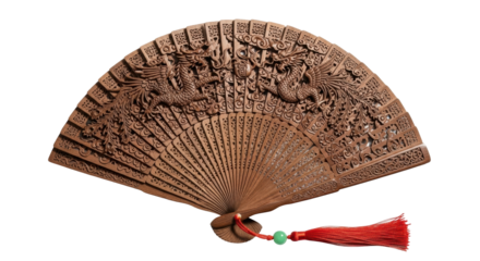 A beautiful traditional hand fan made from carved wood with a detailed depiction of two phoenixes, ornate patterns, and a decorative red tassel with a green bead