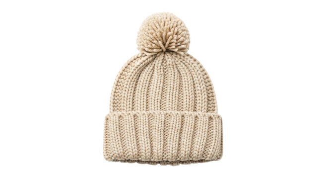 A cozy beige knitted winter beanie hat with a large fluffy pom-pom and a folded cuff, showcasing a chunky ribbed texture and warm, handmade style
