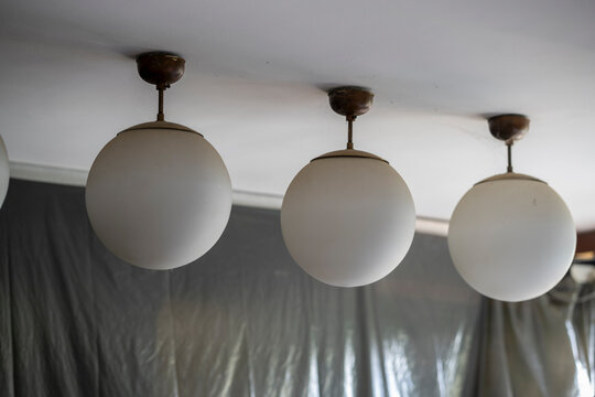 Abandoned lakeside holiday resort with deserted wooden cabins, overgrown vegetation, and decaying buildings reclaimed by nature - Powered by Adobe