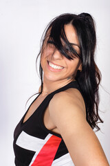 Smiling Young Woman Posing Playfully in Studio