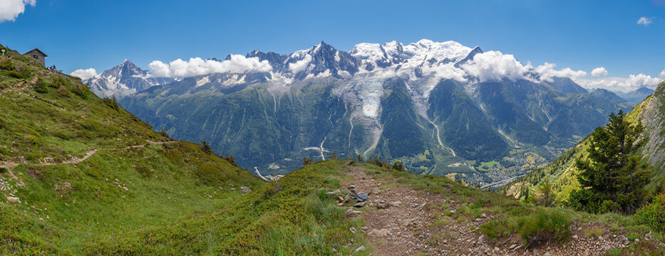 The panorama of Mont Blanc massif Les Aiguilles towers and Aigulle du Vertre peak.
