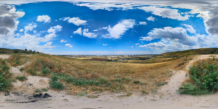 360 panorama of serene landscape with dry grass and distant city skyline, equirectangular projection